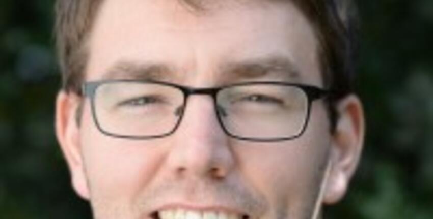 An image of a smiling man (Dr Schmees)